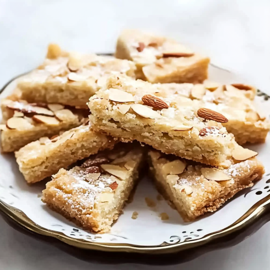 Almond shortbread cookies cut into triangle shapes cooling