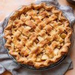 Homemade Dutch apple pie with a golden lattice crust and cinnamon apple filling