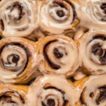 Freshly baked coffee cinnamon rolls topped with creamy espresso frosting and rich cinnamon swirls.